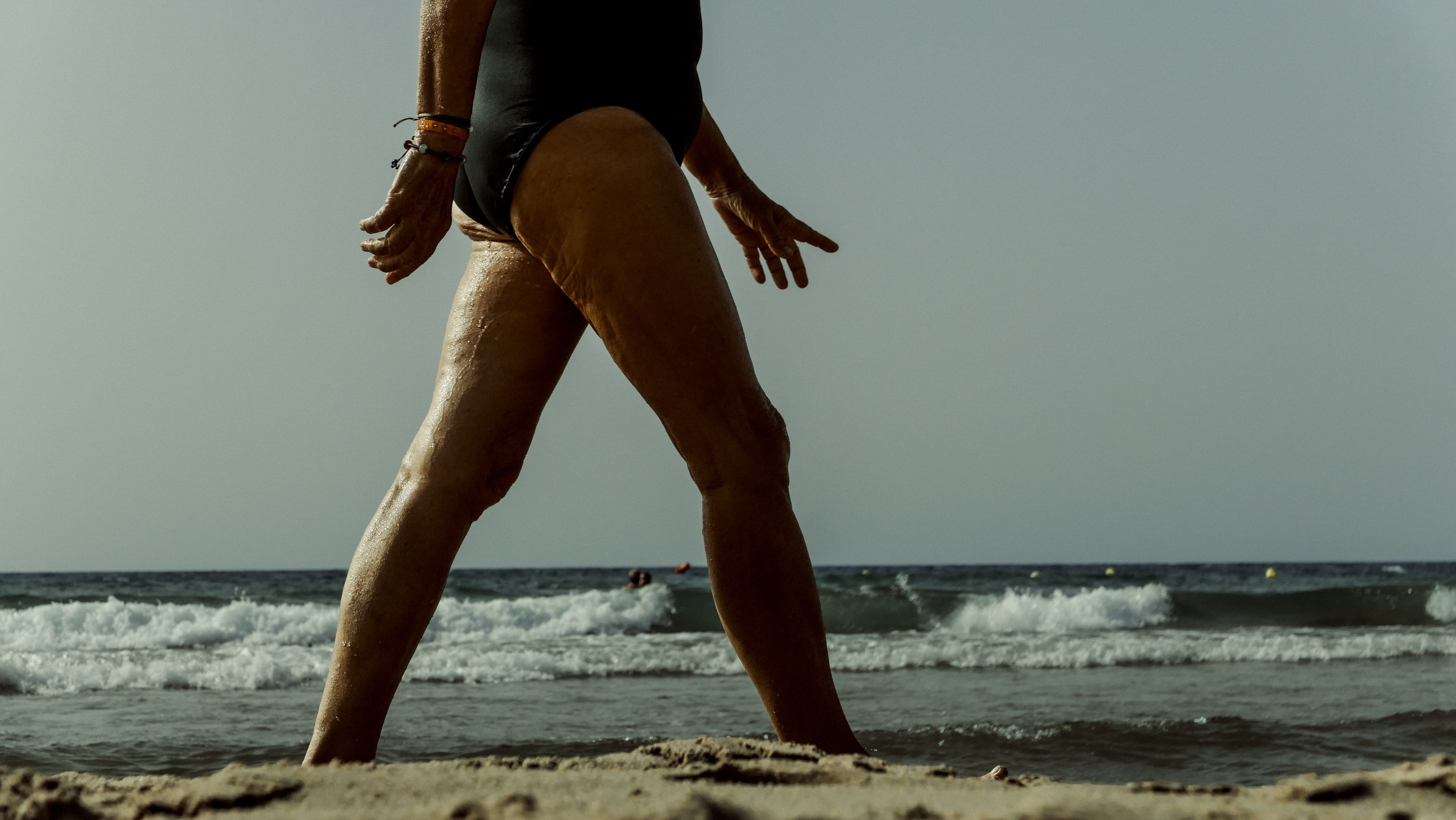 Mid-stride at the water's edge